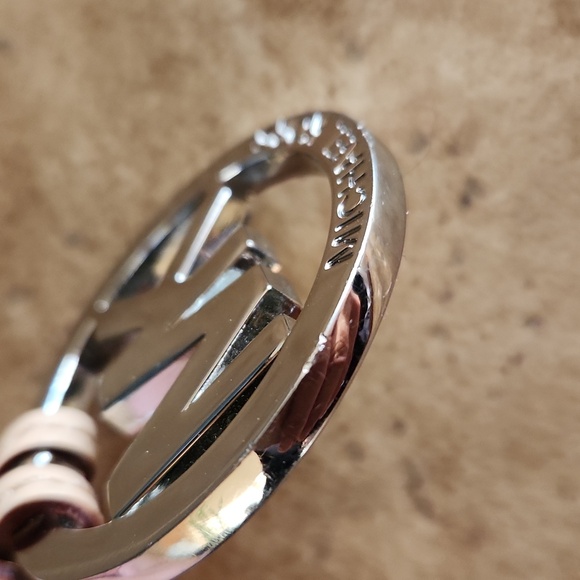 Michael Kors silver round purse charm on tan strap - Picture 4 of 7